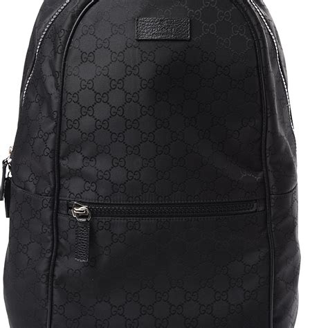 gucci black monogram backpack.